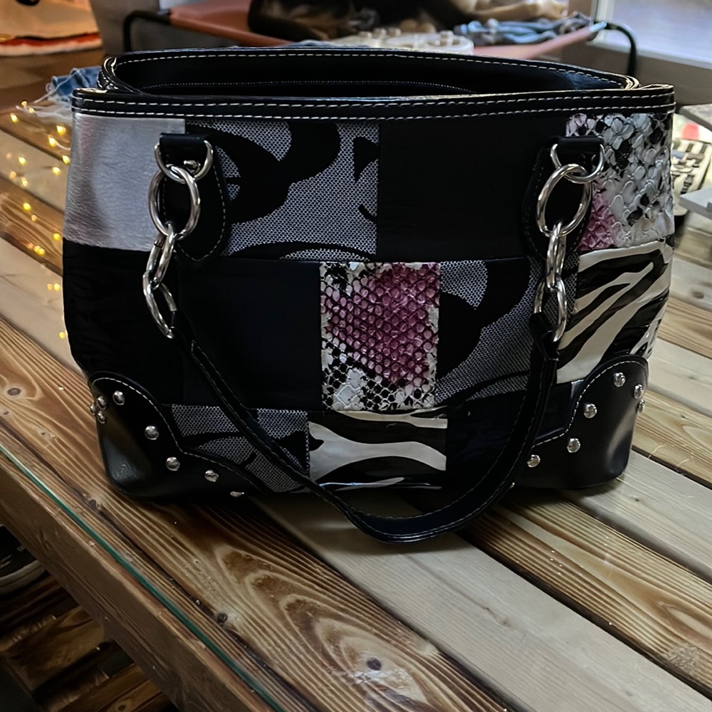 Used Coach bag in good condition. Length is 12” x 6” wide.